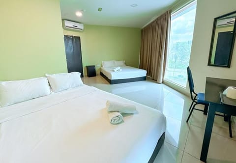 Deluxe Quadruple Room, City View | Iron/ironing board, WiFi (free)