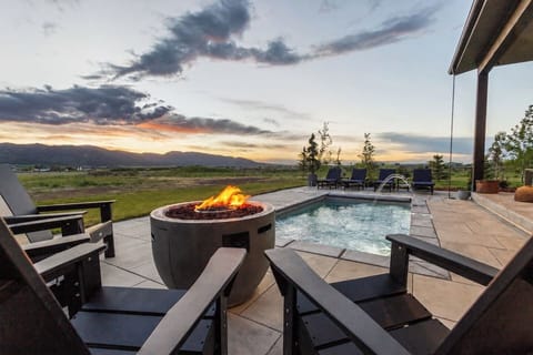 Heated pool, fire pit, and stunning sunset views—the perfect place to unwind after a day of adventure.