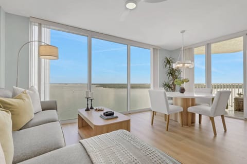 Floor-to-ceiling windows blur the line between indoors and out, filling the living space with natural light and stunning Bay views.