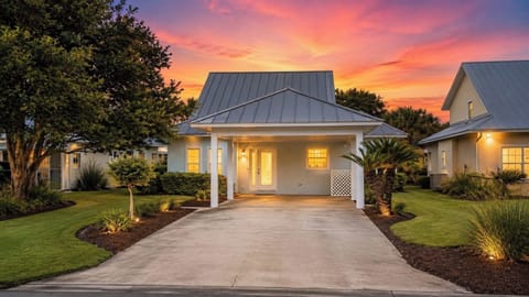 Charming cottage at sunset with garden