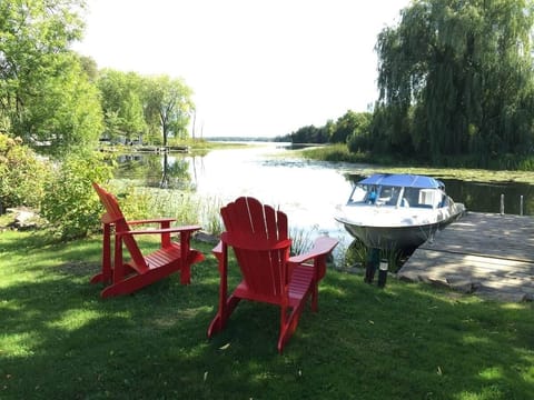 Private dock and lakefront seating—bring your own boat; motorboat shown is not included.