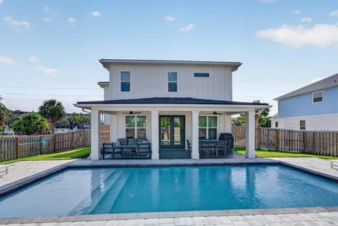 Isola Bella awaits! Swim in the heated saltwater pool or relax under the covered patio - brand-new construction with custom finishes throughout!
