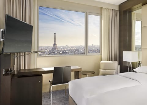 2 twin beds with Eiffel Tower View | Premium bedding, in-room safe, desk, blackout drapes
