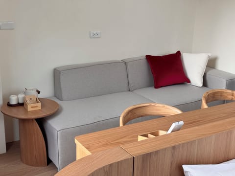Deluxe House, Lake View | Living area | 40-inch flat-screen TV with digital channels