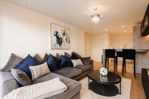 Modern Living Space with Plush Seating & Breakfast Bar