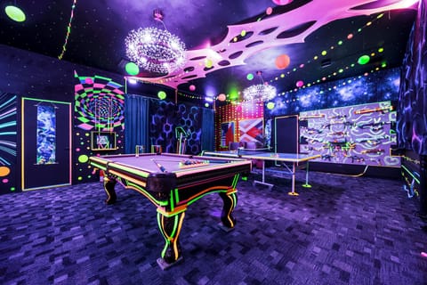 Neon galaxy game room with pool, ping-pong, arcade vibes & LED glow