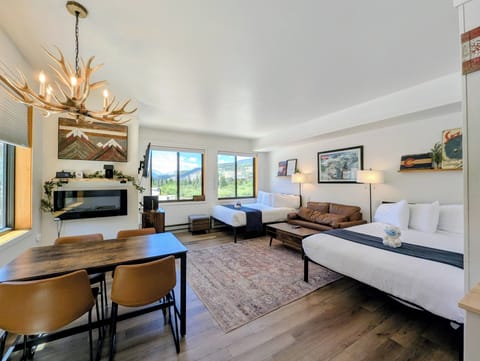 Settle into your cozy mountain retreat with plush beds, a warm fireplace, and sweeping views of the peaks. Your home away from home blends rustic charm with modern comfort.