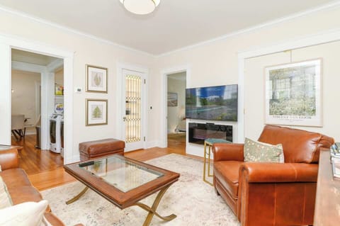 Bright and welcoming living room with cozy seating, natural light, and peaceful energy — perfect for relaxing after a long day.
