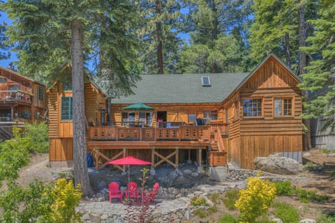Exterior: Deck with lake views, gas grill, and outdoor dining