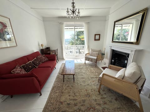 The living room leads onto a front balcony. 