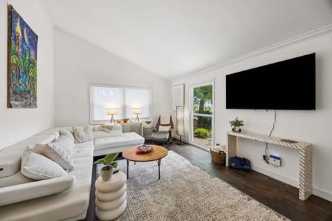 Comfortable living room with wall mounted tv