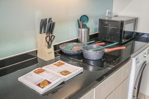 Apartment, Balcony, City View | Private kitchen | Full-size fridge, microwave, stovetop, cookware/dishes/utensils