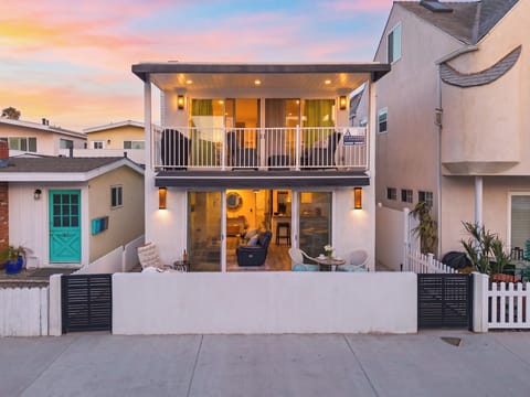Modern coastal townhome at golden hour.