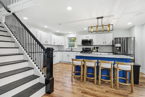 Bright, fully remodeled kitchen with large island seating and plenty of room to gather.
