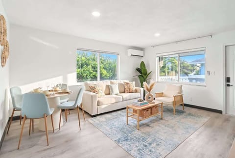 Settle into the bright living room with comfortable seating and a Smart TV for relaxing evenings.