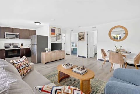Relax in the bright living room with comfortable seating and a Smart TV after a day of exploring.
