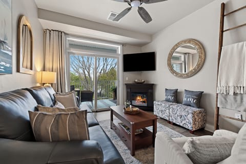 Cozy living room with great view, large tv, electric fireplace, and sleeper sofa