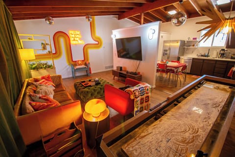 Living Room with TV and shuffleboard table