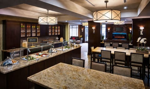 Gather in a cozy dining area, where daily breakfast is served in a stylish and inviting atmosphere.