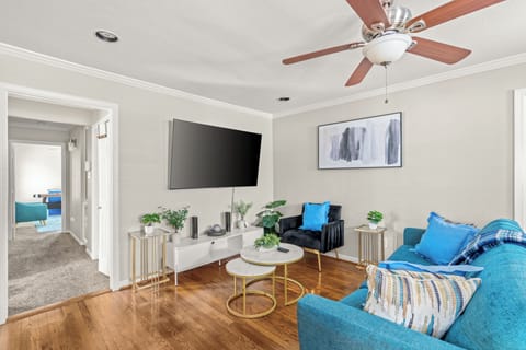 Spacious Living room with 70 inch smart tv.