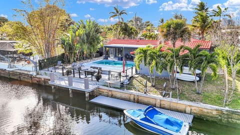 Spacious backyard with private pool and water view