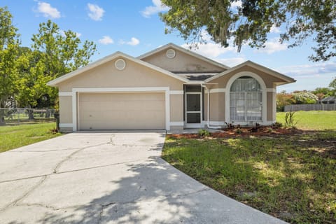 Front of home, driveway, & garage.