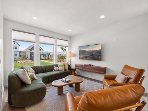 Well appointed and plush with plenty of seating and a 65" Smart TV