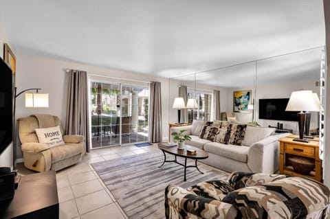 Spacious living room with comfortable seating and patio access