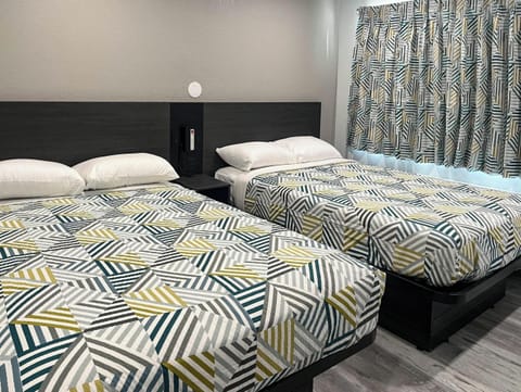 Deluxe Room, 2 Double Beds, Non Smoking, Refrigerator (Mircowave) | WiFi (free), bed sheets