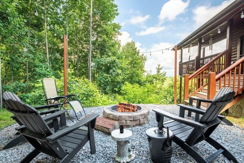 Gather around the crackling fire pit on your private patio, surrounded by forest views and cozy seating—perfect for evening conversations under the stars or morning coffee in nature's embrace.