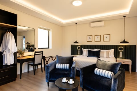 Luxury Room, Mountain View | Minibar (some free items), in-room safe, desk, laptop workspace
