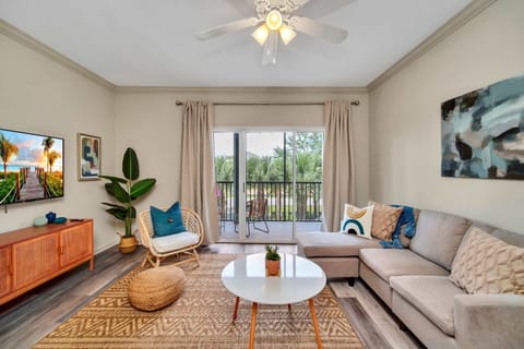 Modern living room with outdoor patio access and smart TV