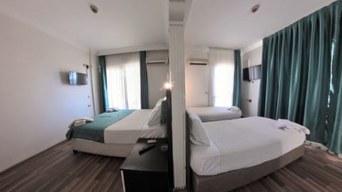 Family Quadruple Room, 2 Bedrooms, Smoking, Sea View | Premium bedding, free WiFi