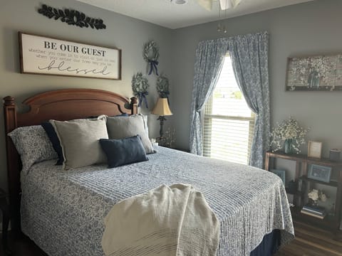 Our beautiful Blue & White  room. Comfy bed and TV at foot of bed.