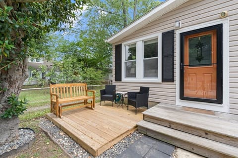 Relax on the private front porch with comfortable seating—perfect for morning coffee or evening conversations.