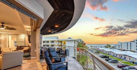 Your private balcony is the perfect place to unwind with Gulf views, comfortable seating, and unforgettable sunsets.