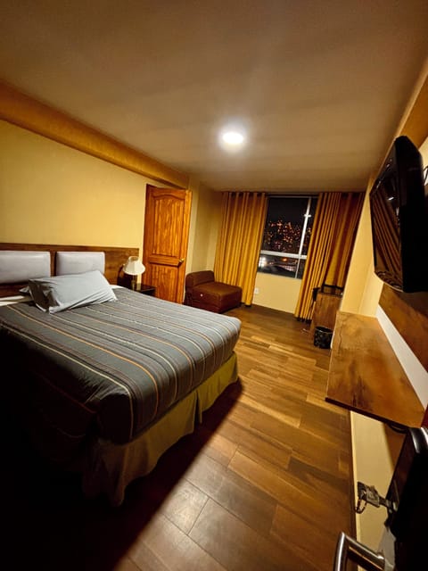 Classic Double Room, City View | Desk, laptop workspace, WiFi (free), bed sheets