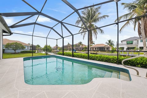 Relax in your private screened lanai featuring a heated pool.