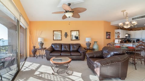 Cozy leather sofas by the balcony doors
