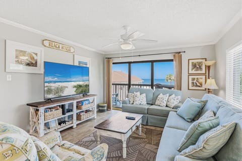 Sink into coastal comfort in your inviting living space, where soft ocean breezes and stunning sea views create the perfect backdrop for your unforgettable beach getaway.