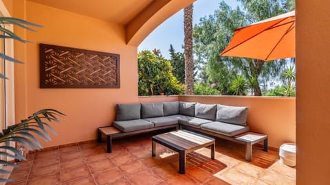 Unwind on your private, sun-drenched patio, perfect for enjoying morning coffee or an evening drink amidst lush greenery. The comfortable outdoor lounge invites relaxation and leisurely conversations. #OutdoorLiving #PrivatePatio #RelaxationSpot #AlFresco