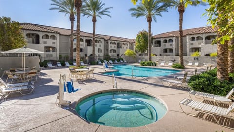 Relax in the hot tub just steps away from the inviting pool area, perfect for unwinding!