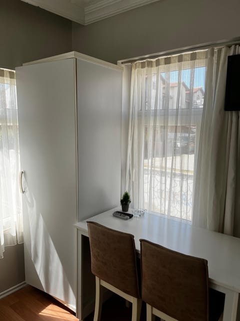 Standard Double Room, City View | Living area | 50-cm TV with satellite channels