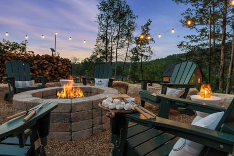 Your very own fire pit for storytelling and s'mores. The fire pit's best hour: flames up, Lone Star Lodge aglow, and the Ozark sky going purple.