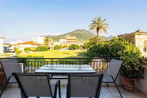 Private balcony with outdoor dining, perfect for morning coffee or relaxing evenings.