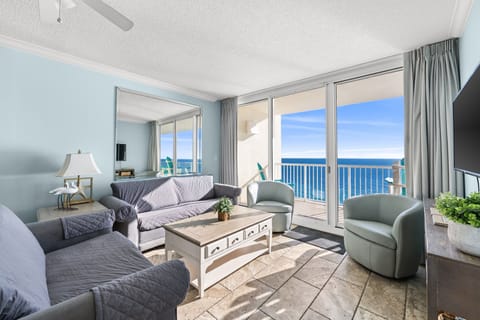 Relax in this coastal living room with ocean views and natural light.