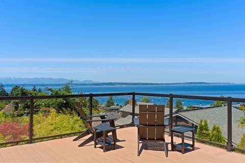 Adirondack seating perched above uninterrupted views of the sound and mountains.