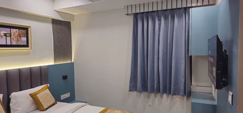 Deluxe Double Room, City View | In-room safe, desk, laptop workspace, iron/ironing board