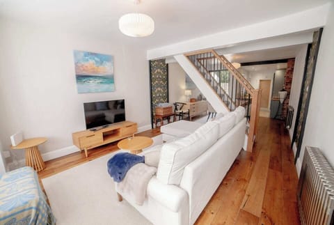 Open plan space consisting of living room, dining room and kitchen.
