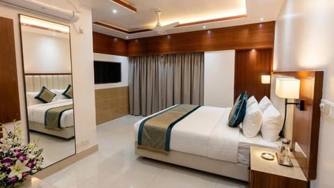 Family Suite, City View | Minibar, blackout drapes, WiFi (free), bed sheets